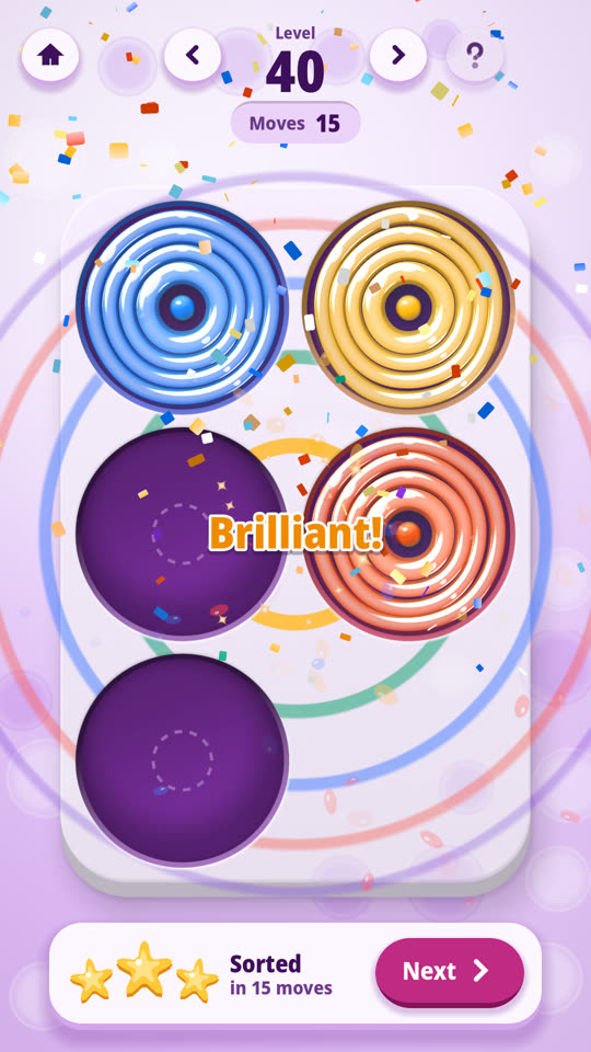 A solved Ring by ring level: each colour gathered in its own stack, with the win banner showing the moves